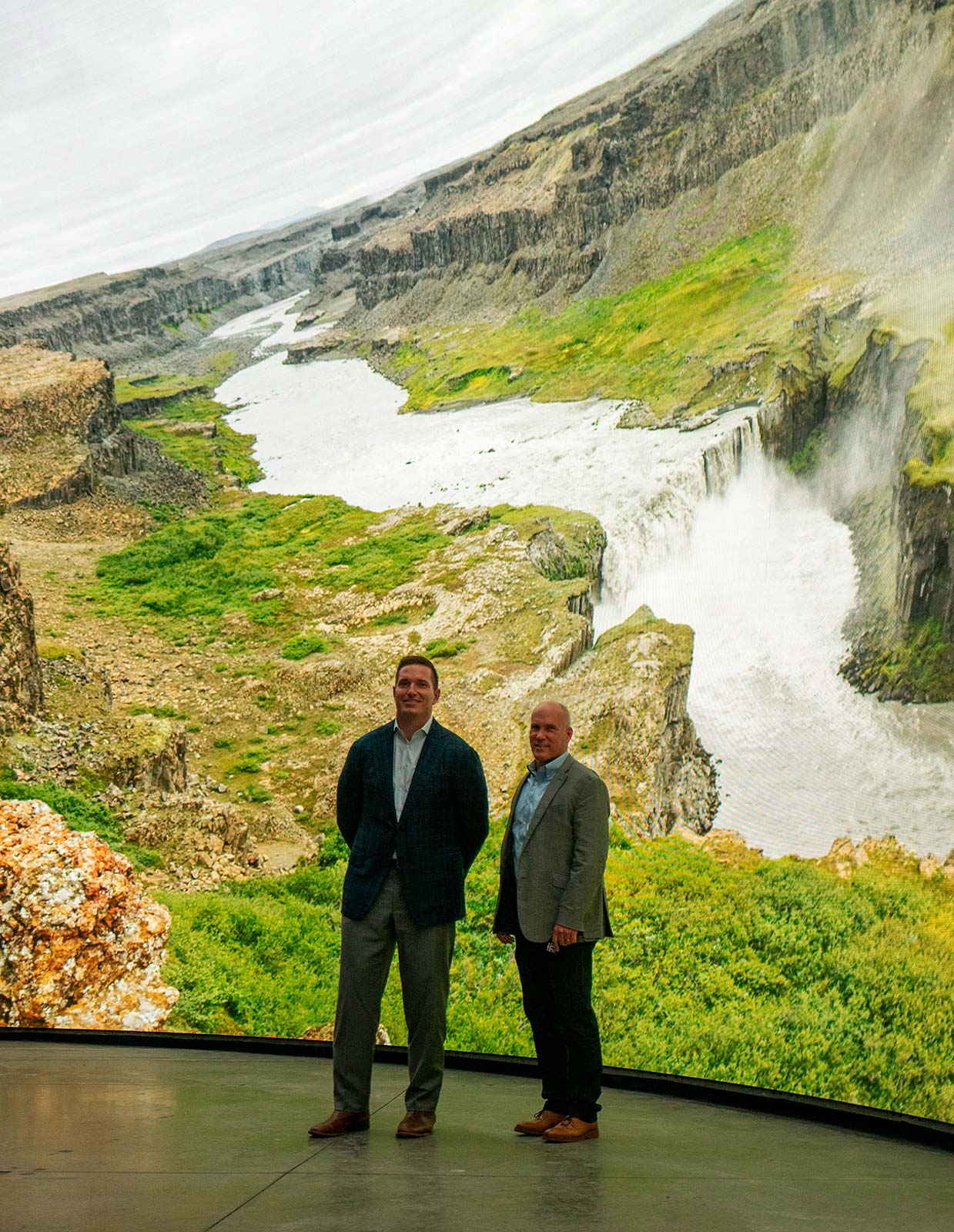 E&S Executive Vice President & General Manager Kirk Johnson with Cosm CEO Jeb Terry in front of DomeX immersive LED dome at the Cosm Experience Center